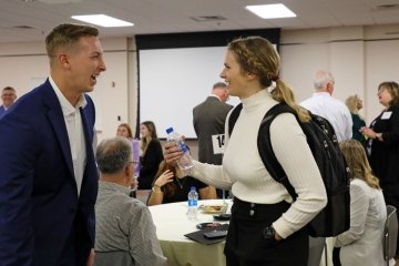 Alyssa Davies '18 chats with a fellow Husky at the 2022 ZIPD Conference